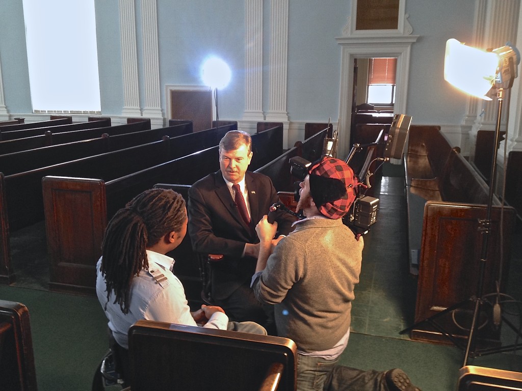 Ade Adepitan (Left) interviews Niagara Falls Mayor Paul Dyster (Center).